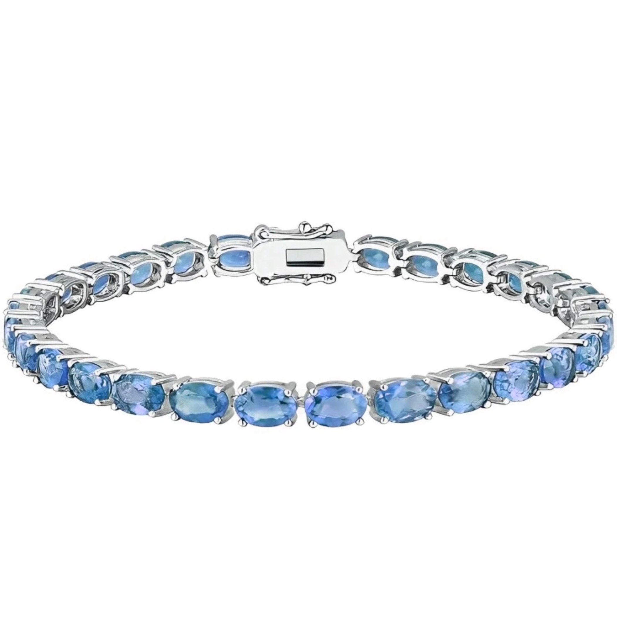 A tennis bracelet featuring a single row of oval-cut blue stones set in a silver-toned metal with a secure clasp.