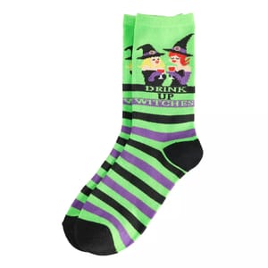 Green and purple striped sock with a Halloween theme featuring cartoon witches and the phrase \“Drink up witches.\“