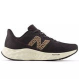 Black athletic shoe with a leopard-print \“N\“ logo and a white, cushioned Fresh Foam midsole.