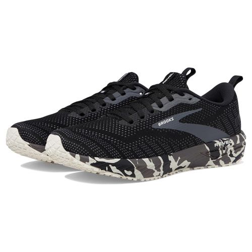 A pair of black Brooks running shoes with white and grey camouflage detailing on the sole.