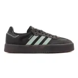 A black Adidas Samba sneaker with mint green stripes, thick black sole, and a textured toe area.