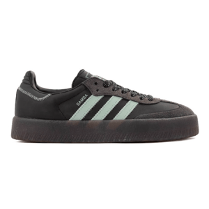 A black Adidas Samba sneaker with mint green stripes, thick black sole, and a textured toe area.