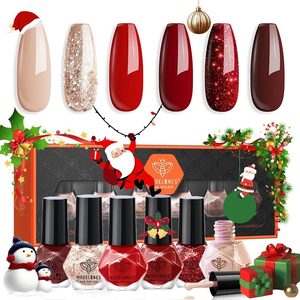 Christmas-themed nail polish set by Modelones, featuring six festive colors including nude, glittery gold, red, and dark red shades, with holiday decorations such as Santa and ornaments.