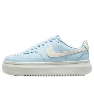 Light blue sneaker with a white Nike swoosh, thick sole, and perforated detailing on the toe area.