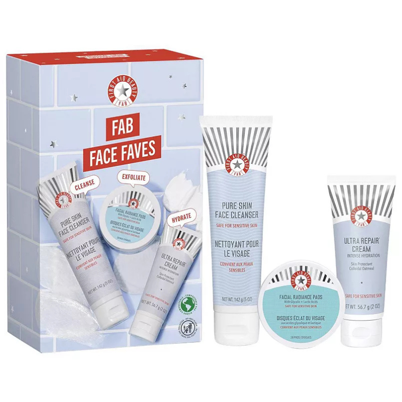 The First Aid Beauty Skincare Set includes Pure Skin Face Cleanser (142.9g), Facial Radiance Pads (28 pads), and Ultra Repair Cream (56.7g). This set focuses on cleansing, exfoliating, and hydrating sensitive skin.