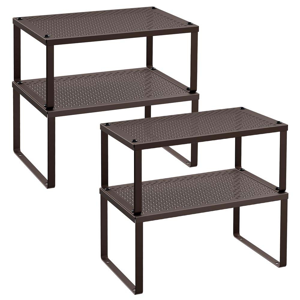 Two brown, perforated metal shelves with a two-tier design, ideal for organizing items.