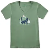 Green V-neck t-shirt featuring a graphic of a wolf in a forest with trees and stars.