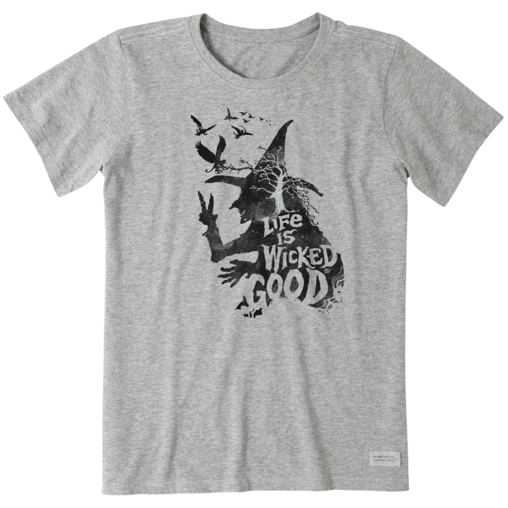 A gray t-shirt featuring a black silhouette of a witch with birds and the text \“Life is Wicked Good.\“