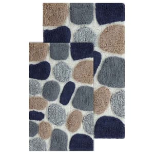 2-piece pebble-inspired bathroom rug set features a pattern of textured, stone-like shapes in blue, gray, and beige tones.