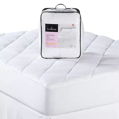 A Cuddl Duds queen mattress pad is presented on a bed, featuring a quilted design with a packaging bag displayed on top.