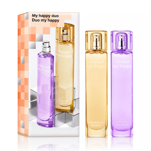Clinique My Happy Duo includes two perfumes: \“Cookies & Kisses\“ with a warm, amber scent, and \“Cocoa & Cashmere\“ featuring a sweet, cozy fragrance. Each perfume comes in a sleek, colorful bottle.