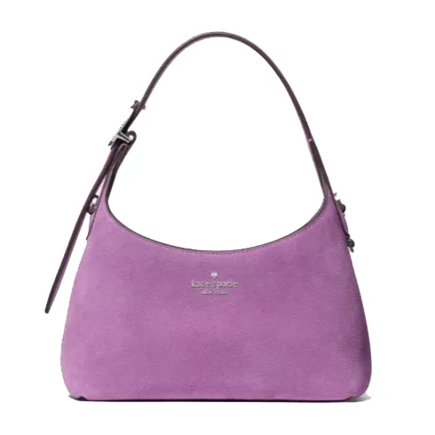 Purple suede handbag with a single adjustable strap and the \“kate spade new york\“ logo on the front.