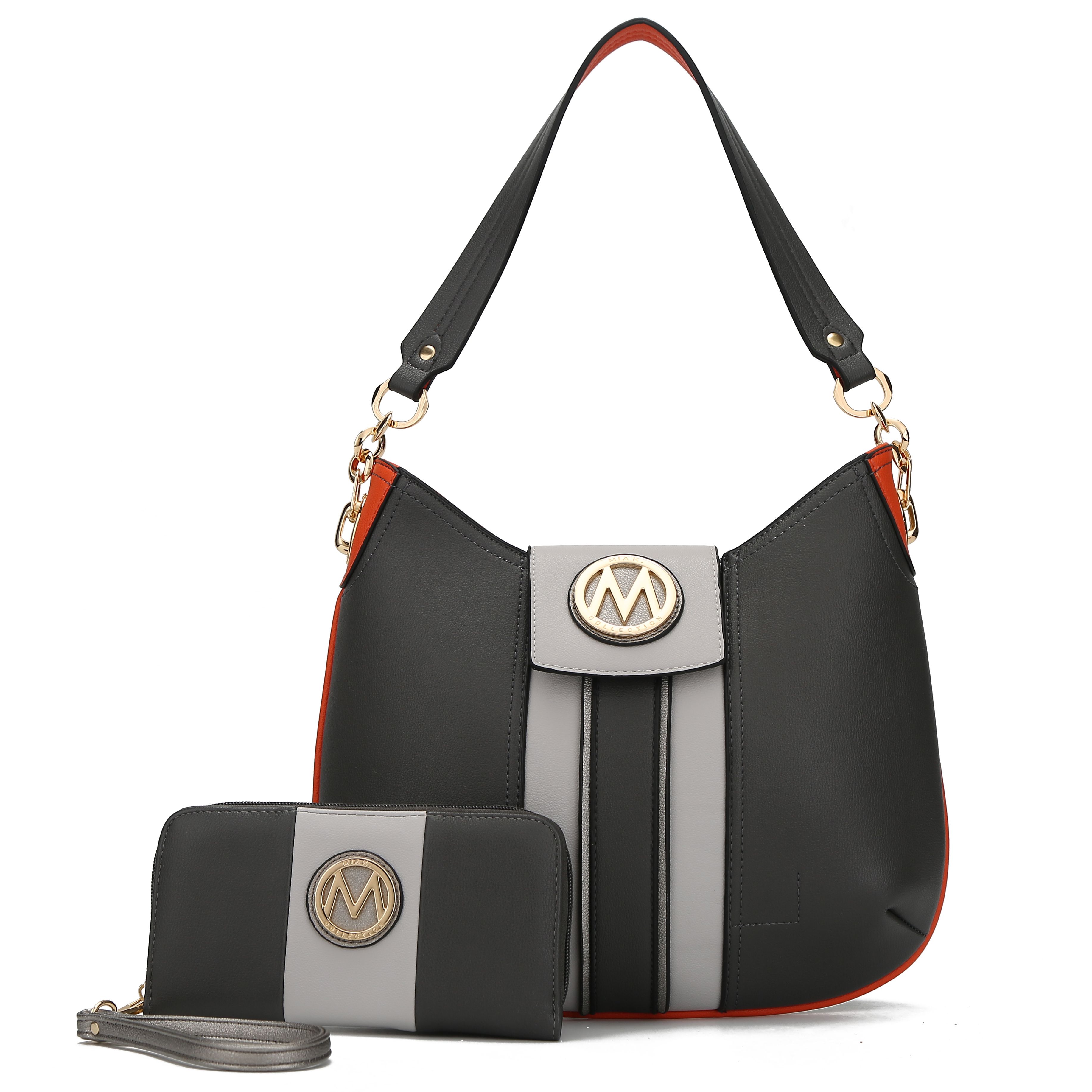 The MKF Hobo & Wristlet set features a dark gray and light gray color block design with orange accents. Both pieces have a gold-tone \“M\“ logo, with the hobo bag having a shoulder strap and the wristlet including a removable strap.