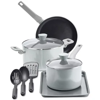 Cookware set including a frying pan, two saucepans with lids, a baking sheet, and three kitchen utensils.