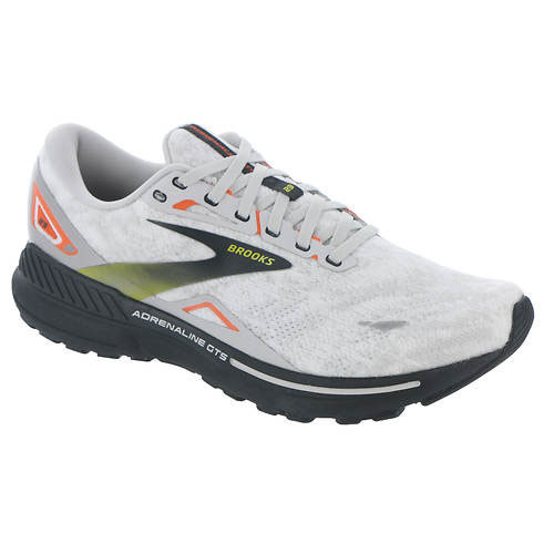 Brooks Adrenaline GTS 23 is a lightweight running shoe featuring a white upper with black and orange accents, GuideRails for stability, and a responsive midsole for comfort.
