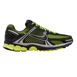 A Nike running shoe featuring a black and neon green color scheme with mesh panels, a prominent swoosh logo, and a textured, cushioned sole for support.