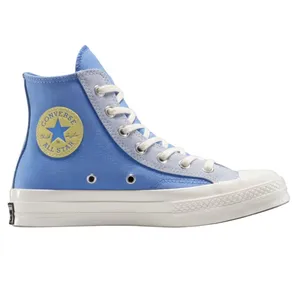 A blue Converse Chuck Taylor All Star high-top sneaker with white laces, a yellow circular logo on the side, metal eyelets, and a white rubber sole.