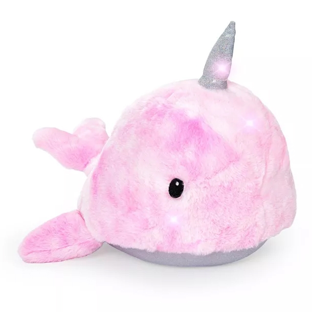 A pink plush narwhal toy with a sparkling silver horn and small black eyes.