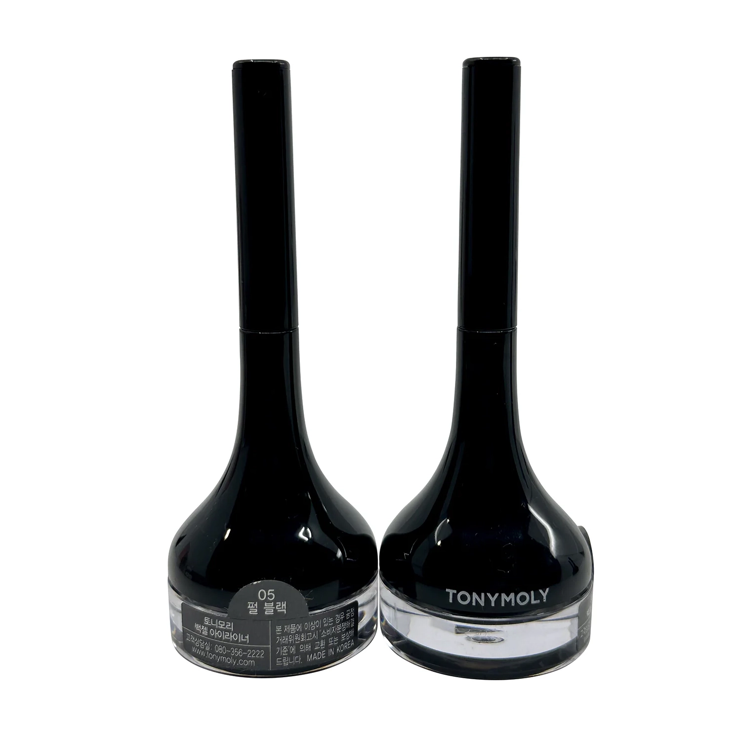 Two black containers of TonyMoly gel eyeliner, each with a long handle and a round base labeled in Korean, indicate \“05 Pearl Black.\“