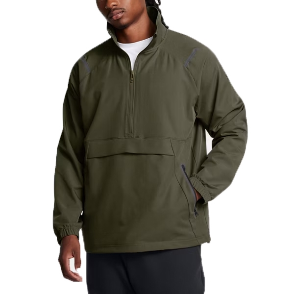 The UA Unstoppable Anorak is an olive green, half-zip pullover jacket with long sleeves, elastic cuffs, and a front kangaroo pocket. It's designed for comfort and versatility, suitable for outdoor activities.