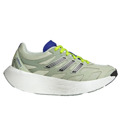 A light green athletic sneaker with a thick white sole, featuring neon yellow laces, black and white stripe accents, and a blue detail on the tongue.