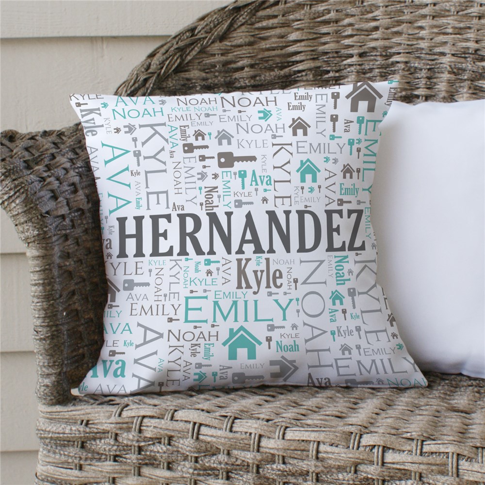Personalized pillow with the name \“Hernandez\“ surrounded by names like Emily, Noah, Ava, and Kyle in various fonts and colors, featuring icons of houses and keys.
