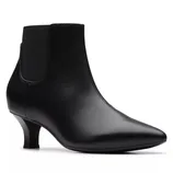 A black leather ankle boot with a low, slender heel and elastic side panels, featuring a sleek, pointed toe design.