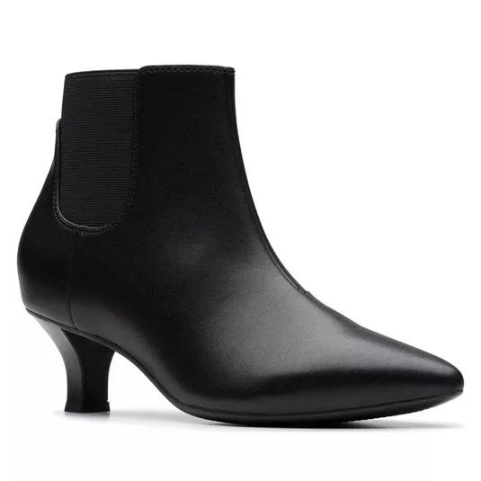 A black leather ankle boot with a low, slender heel and elastic side panels, featuring a sleek, pointed toe design.