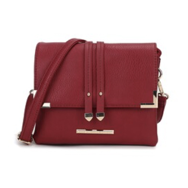A red shoulder bag with gold accents, featuring a flap closure and two decorative straps on the front.