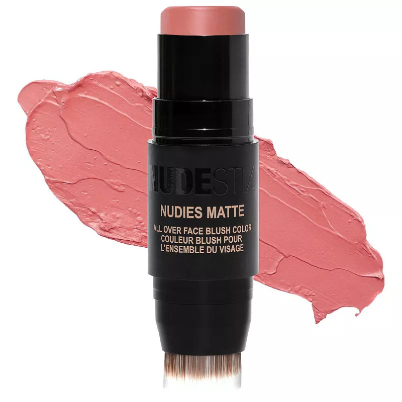 NUDESTIX Nudies Matte All Over Face Blush Color in a soft pink shade, packaged in a stick with a built-in blending brush.