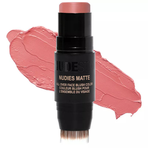 NUDESTIX Nudies Matte All Over Face Blush Color in a soft pink shade, packaged in a stick with a built-in blending brush.