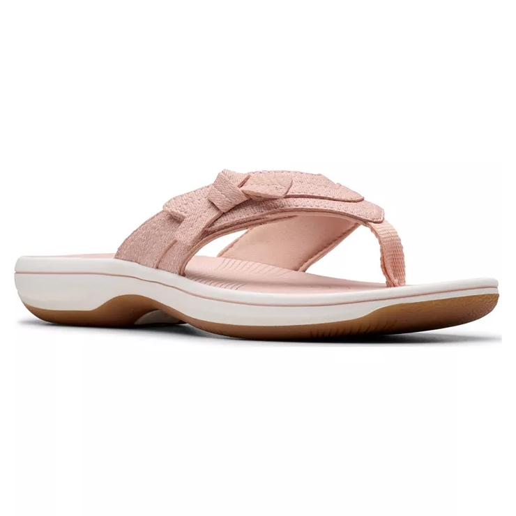A pink women's sandal with a textured upper strap, a bow accent, a thong-style toe strap, and a cushioned white and brown outsole.