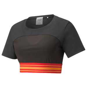A cropped Puma basketball top featuring a semi-transparent mesh panel, short sleeves, and a solid black upper with a red and yellow striped waistband.