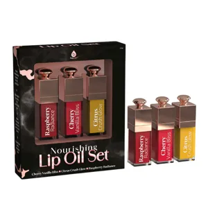 Nourishing Lip Oil Set featuring three flavors: Raspberry Radiance, Cherry Vanilla Bliss, and Citrus Crush Glow, displayed in a sleek package with rose gold caps.