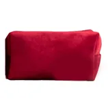 Red velvet rectangular pouffe with soft texture and simple design.