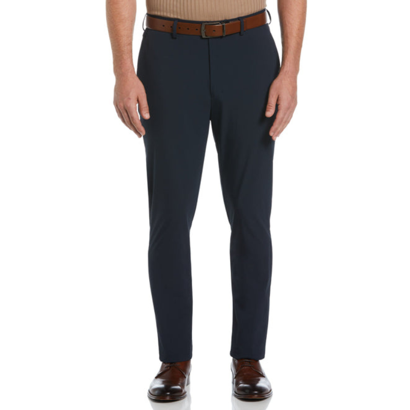 Slim Fit Tech 2.0 Suit Pants are navy blue with a tailored fit and belt loops, made from a stretchy material that allows for comfort and movement. They're paired with a brown belt and shoes.
