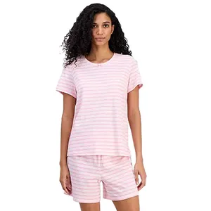 A person is wearing a matching pajama set consisting of a pink and white striped short-sleeve top and shorts.
