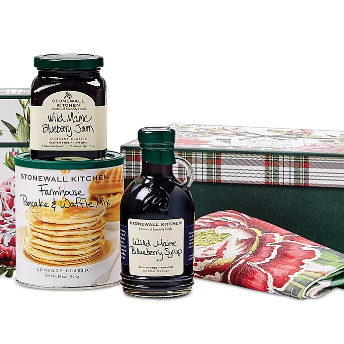 Stonewall Kitchen Pancake Gift Set includes Wild Maine Blueberry Jam, Wild Maine Blueberry Syrup, and Farmhouse Pancake & Waffle Mix, packaged in decorative floral-printed and plaid containers.