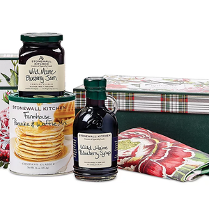 Stonewall Kitchen Pancake Gift Set includes Wild Maine Blueberry Jam, Wild Maine Blueberry Syrup, and Farmhouse Pancake & Waffle Mix, packaged in decorative floral-printed and plaid containers.