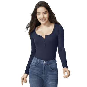 A woman is wearing a dark blue long-sleeve henley top and high-waisted blue jeans.