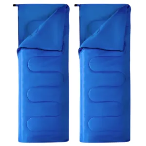 Two blue rectangular sleeping bags with quilted patterns, partially unzipped and laid flat.