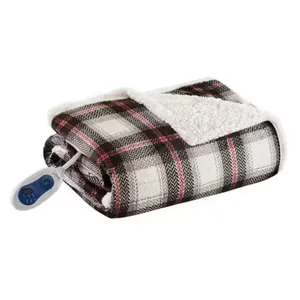 A folded plaid-heated blanket with a white plush lining, featuring an attached controller for adjusting heat settings.