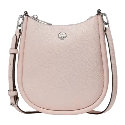 A light pink, textured leather crossbody bag with a silver logo, adjustable strap, and zipper closure.