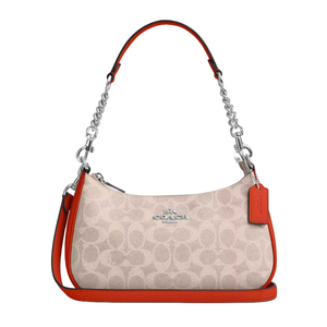 Coach Outlet Shoulder Bag with a signature pattern in beige, featuring red leather accents and a chain strap. The design includes a silver logo and a removable leather tag with a detachable shoulder strap.