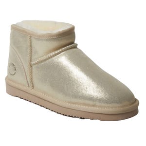 A gold metallic ankle boot with a plush lining, featuring a logo on the heel and a low-profile rubber sole.
