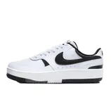 A white and black low-top sneaker with a prominent swoosh logo, featuring a white sole with a black bottom section.