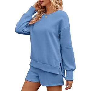 A blue women's loungewear set comprising a long-sleeve sweatshirt and matching shorts.