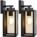 Two rectangular black outdoor wall lights showcasing exposed filament bulbs inside clear glass panels, mounted on a flat backing plate.