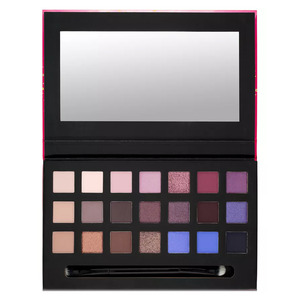 A makeup palette featuring 20 eyeshadow shades in various neutral, pink, purple, and blue tones, accompanied by a double-ended applicator and a built-in mirror.
