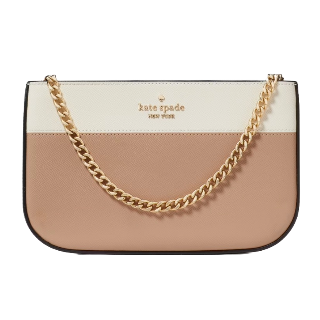 A Kate Spade New York pochette featuring a color-blocked design with cream and blush tones, adorned with a gold chain strap and the brand's logo.